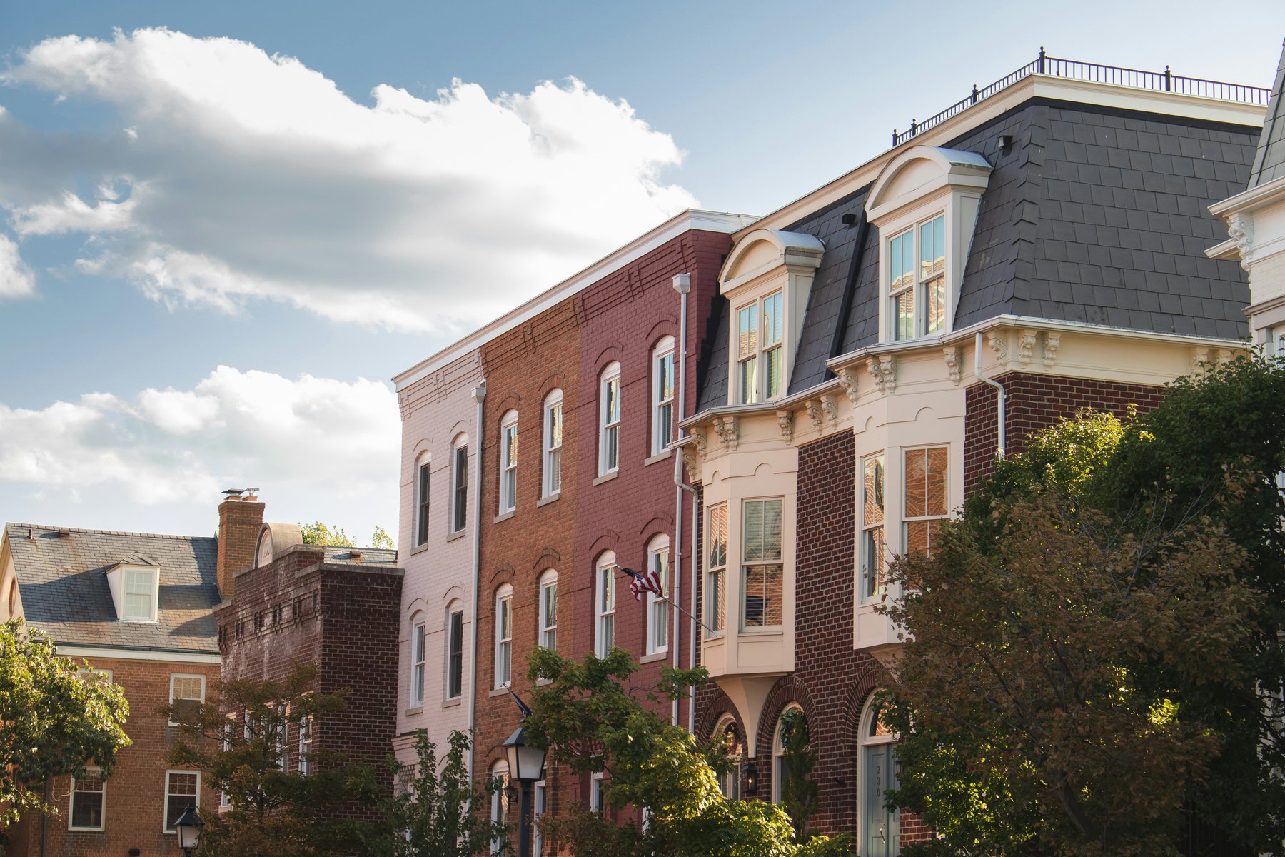Row of brick townhouses with trees